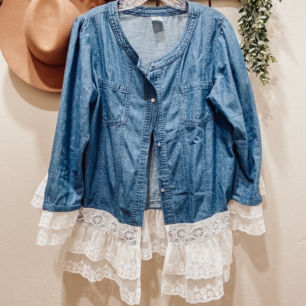 Super cute jean top with lace along sleeves and hem.